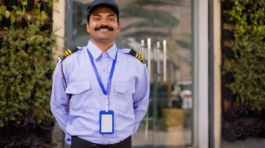 stock-photo-portrait-of-security-guard-with-hands-behind-back-while-working-at-gate-2451538717-coPsN3o1dG-transformed